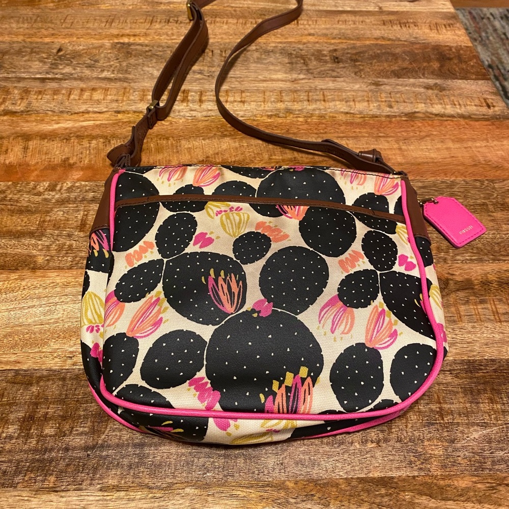 Fossil brand leather purse with brown and pink details and black cactus design